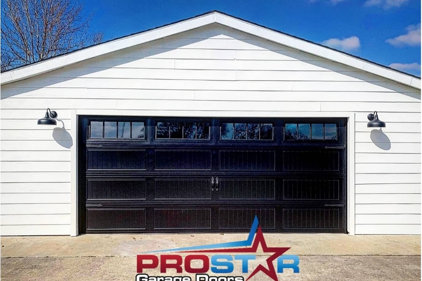 New black double garage door with windows after replacement by ProStar