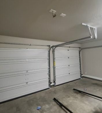 Garage door tracks and ceiling before a new opener was installed